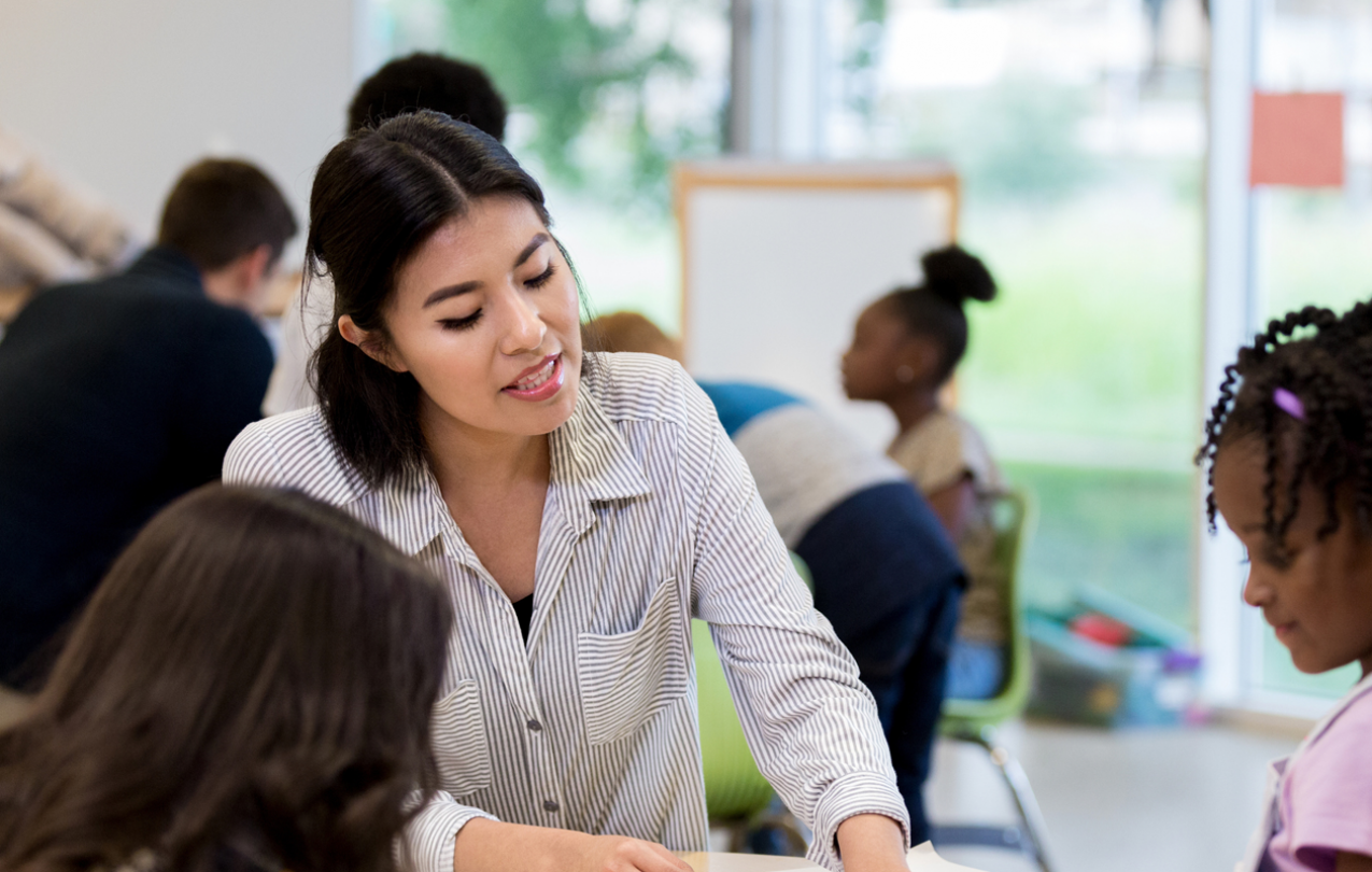 Paraprofessional helping students Getty Images